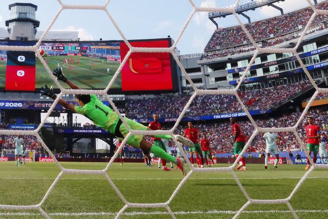 Morocco's goalkeeper #01 Yassine Bounou concedes a goal scored by France's forward #10 Kylian Mbappe and his team's first goal during the 2026 World Cup football tournament quarter-final match between France and Morocco at Boston Stadium in Foxborough on July 9, 2026.  (Photo by CHARLY TRIBALLEAU / AFP)