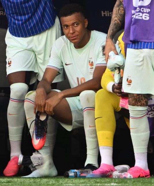 France's forward #10 Kylian Mbappe sits with an ice pack on his ankle during the 2026 World Cup football tournament quarter-final match between France and Morocco at Boston Stadium in Foxborough on July 9, 2026.  (Photo by MAURO PIMENTEL / AFP)