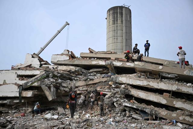 Workers remove debris from a collapsed building in Caraballeda, La Guaira state, Venezuela, on July 9, 2026, following the June 24 earthquakes. The United Nations launched an urgent appeal on July 8, 2026 for nearly $300 million towards Venezuela earthquake relief operations as the death toll from the disaster rose to more than 3,800 people. (Photo by Raul ARBOLEDA / AFP)