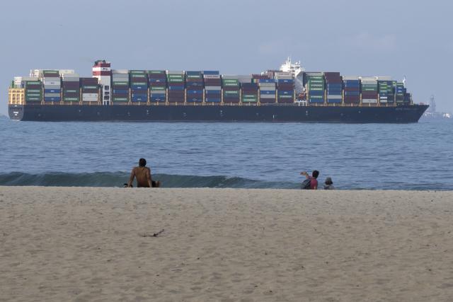 A cargo ship sails off Copacabana Beach in Rio de Janeiro, Brazil on July 9, 2026. (Photo by Pablo PORCIUNCULA / AFP)