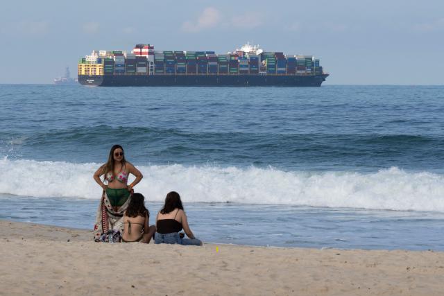 A cargo ship sails off Copacabana Beach in Rio de Janeiro, Brazil on July 9, 2026. (Photo by Pablo PORCIUNCULA / AFP)