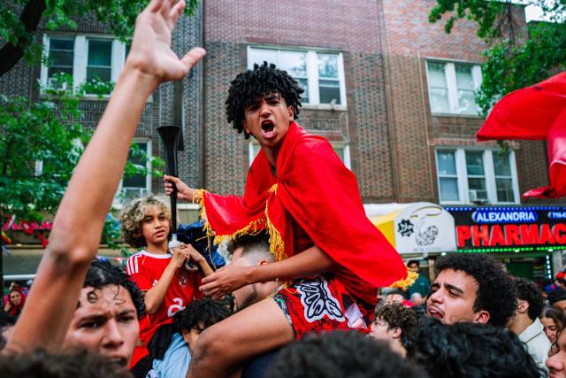 Moroccan fans celebrate their team participation in the World Cup, despite the 2-0 loss against France in the quarter-final match between France and Morocco in the Little Morocco area in the Queens borough of New York City on July 9, 2026. (Photo by Angelina Katsanis / AFP)
