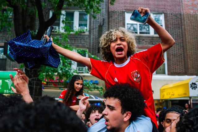 Moroccan fans celebrate their team participation in the World Cup, despite the 2-0 loss against France in the quarter-final match between France and Morocco in the Little Morocco area in the Queens borough of New York City on July 9, 2026. (Photo by Angelina Katsanis / AFP)