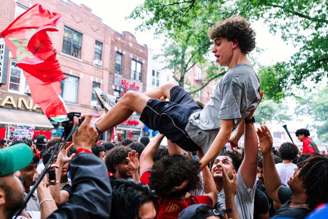 Morocco fans celebrate their team participation in the World Cup, despite the 2-0 loss against France in the quarter-final match between France and Morocco, in the Little Morocco area in the Queens borough of New York City on July 9, 2026. (Photo by Angelina Katsanis / AFP)