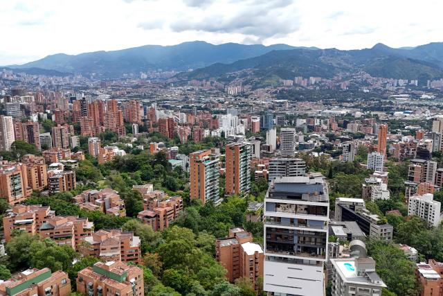 This aerial view shows the El Dorado neighborhood, where a property belonging to former Colombian National Team goalkeeper Rene Higuita is located, in Medellin, Colombia, on July 9, 2026. A Colombian court on July 9 ordered the seizure of a property belonging to former footballer Rene Higuita after concluding that funds from Pablo Escobar's cartel were used to purchase the house. (Photo by Diego Botero / AFP)