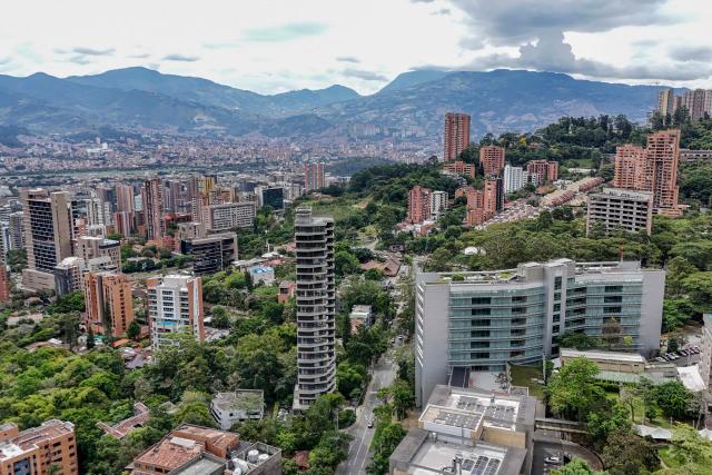 This aerial view shows the El Dorado neighborhood, where a property belonging to former Colombian National Team goalkeeper Rene Higuita is located, in Medellin, Colombia, on July 9, 2026. A Colombian court on July 9 ordered the seizure of a property belonging to former footballer Rene Higuita after concluding that funds from Pablo Escobar's cartel were used to purchase the house. (Photo by Diego Botero / AFP)