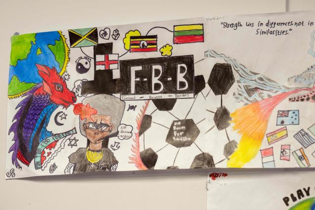 Artwork produced by students participating in the 'Football Beyond Borders' programme is displayed at Our Lady & St Chad Catholic School, in Wolverhampton, central England on June 12, 2026. FBB (Football Beyond Borders) works with young people from areas of socio-economic disadvantage who are disengaged at school but passionate about football, to help them finish school with the skills and grades to make a successful transition into adulthood. (Photo by Oli SCARFF / AFP) / TO GO WITH AFP STORY BY Alexandra Del PERAL