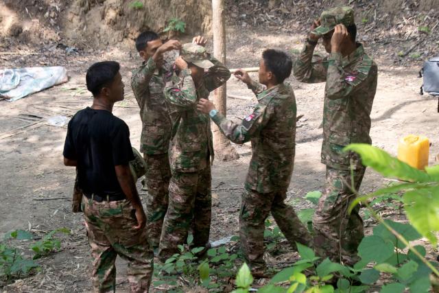 This photo taken on May 19, 2026 show members of the Mandalay People's Defence Forces (MDY-PDF), preparing for a training session at a secret training camp in an undisclosed location in Myanmar's Saging Region. A civil war erupted after the country's military ousted the elected government of Aung San Suu Kyi in a 2021 coup and cracked down on anti-coup protests, prompting pro-democracy activists to take up arms against the junta, which was already battling powerful ethnic armed groups in decade-long conflicts. (Photo by AFP) / TO GO WITH: Myanmar-war-democracy-fighters