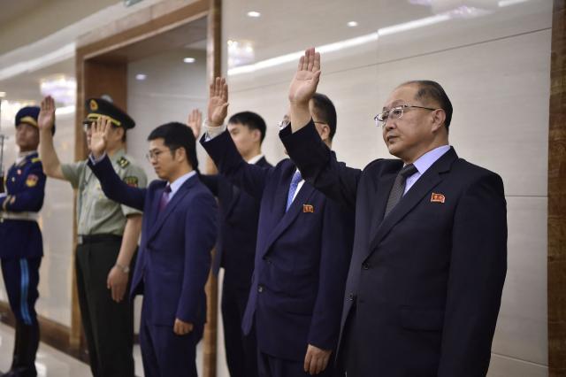 North Korea's Prime Minister Pak Thae Song (R) and his delegation prepare to leave for China at the Pyongyang International Airport in Pyongyang on July 10, 2026. (Photo by KIM Won Jin / AFP)