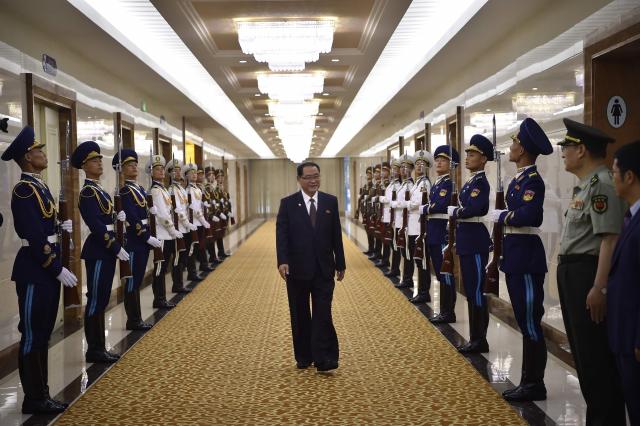 North Korea's Prime Minister Pak Thae Song (C) and his delegation prepare to leave for China at the Pyongyang International Airport in Pyongyang on July 10, 2026. (Photo by KIM Won Jin / AFP)