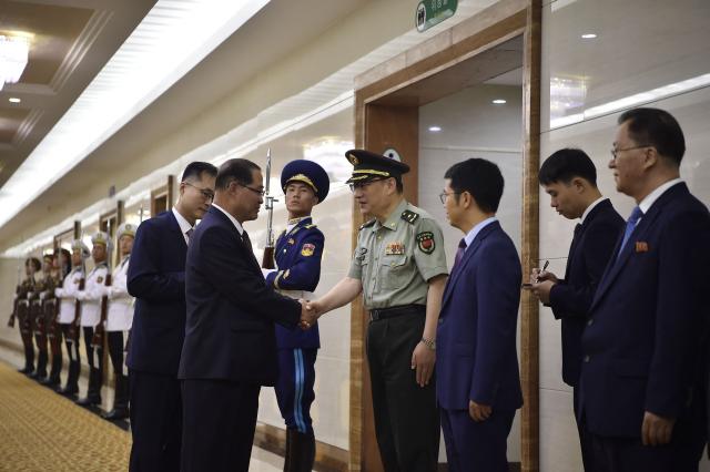 North Korea's Prime Minister Pak Thae Song (C) and his delegation prepare to leave for China at the Pyongyang International Airport in Pyongyang on July 10, 2026. (Photo by KIM Won Jin / AFP)