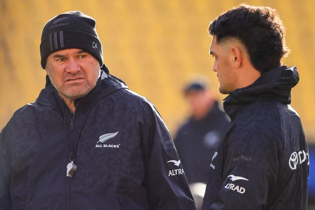 New Zealand's head coach Dave Rennie (L) speaks with New Zealand's Quinn Tupaea during the captain's run training session in Wellington on July 10, 2026, ahead of the rugby Nations Championship match against Italy. (Photo by Grant Down / AFP)