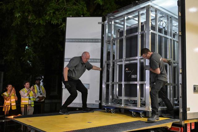 Workers unload a specially designed crate carrying the Bayeux Tapestry at the British Museum in central London early on July 10, 2026, as the 11th-century artwork depicting the 1066 Norman conquest of England arrives ahead its first UK exhibition from September. The medieval Bayeux Tapestry arrived in London in the early hours of July 10, after a hugely complicated journey to leave France for the first time in more than 900 years for an exhibition in the British capital. (Photo by Richard A. Brooks / AFP)