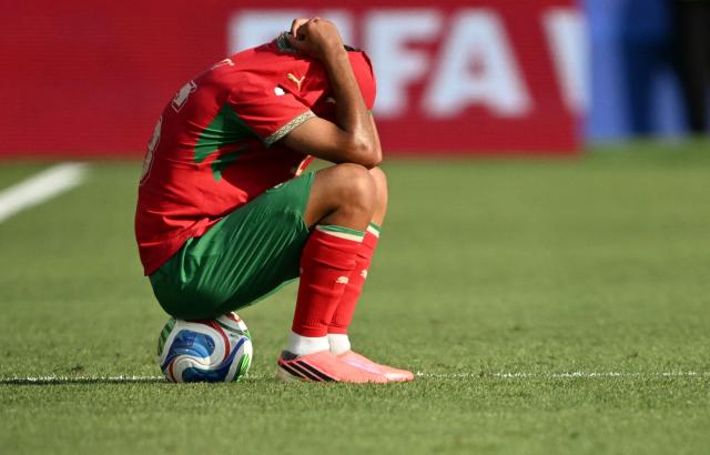 TOPSHOT - Morocco's forward #16 Gessime Yassine reacts after losing the 2026 World Cup football tournament quarter-final match between France and Morocco at Boston Stadium in Foxborough on July 9, 2026.  (Photo by MAURO PIMENTEL / AFP)