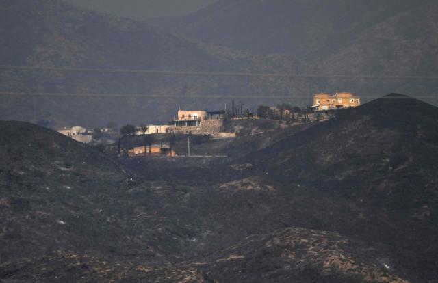 Firefighters work on the site on a wildfire that killed 11 near Los Gallardos, in Almeria Province, on July 10, 2026. Eleven people were killed and 19 are missing after a wildfire in Bedar, in Los Gallardos district, with four victims who may have been British who were burned in their car, authorities said. (Photo by JOSE JORDAN / AFP)