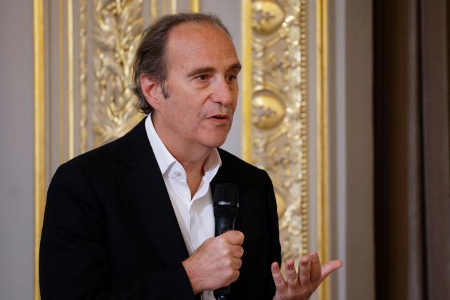 (FILES) French CEO of Iliad group and Free Telecom Xavier Niel speaks during a meeting with members of the artificial intelligence sector as part of a summit on artificial intelligence hosted by France's President at the Elysee Presidential Palace in Paris, France, on May 21, 2024. French tycoon Xavier Niel is to pay 5.1 billion euros ($5.8 billion) to become the main shareholder in British mobile phone giant Vodafone, his family-owned acquisition vehicle Vega said on July 10, 2026. (Photo by Yoan VALAT / POOL / AFP)