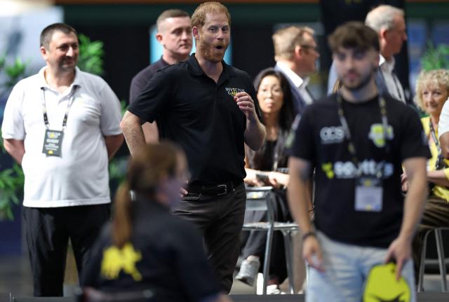 Britain's Prince Harry, Duke of Sussex, reacts as he watches as players play a match of pickleball during an event to mark the 'Invictus Games Birmingham 2027: One Year To Go', at the NEC in Birmingham, central England on July 10, 2026. (Photo by Darren Staples / AFP)