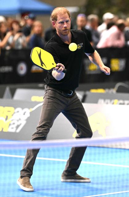 Britain's Prince Harry, Duke of Sussex, reacts as he takes part in a match of pickleball during an event to mark the 'Invictus Games Birmingham 2027: One Year To Go', at the NEC in Birmingham, central England on July 10, 2026. (Photo by Oli SCARFF / AFP)