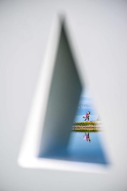 A caddie walks during the second round of the Amundi Evian Championship at Evian Resort Golf Club, in Evian-Les-Bains, center eastern France on July 9, 2026. (Photo by OLIVIER CHASSIGNOLE / AFP)