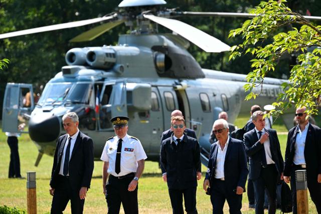 France's President Emmanuel Macron (C) arrives to visit sports facilities in Loudenvielle, south-western France, on July 10, 2026. (Photo by Lionel BONAVENTURE / POOL / AFP)