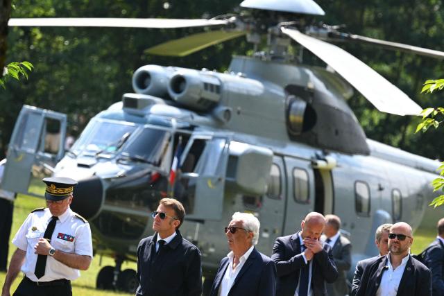 France's President Emmanuel Macron (2ndL) arrives to visit sports facilities in Loudenvielle, south-western France, on July 10, 2026. (Photo by Lionel BONAVENTURE / POOL / AFP)