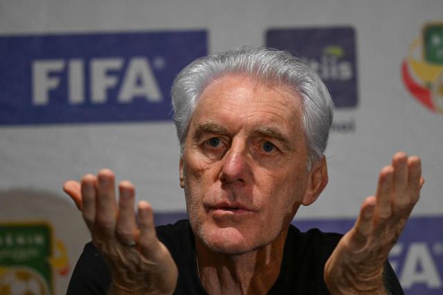 (FILES) South Africa's coach Hugo Broos gestures during a press conference ahead of FIFA World Cup 2026 Africa group qualifier football match between Sout Africa and Benin in Abidjan on March 24, 2025. Candidates, including Pitso Mosimane, have applied to succeed Hugo Broos as coach of South Africa after the exit of the Belgian was confirmed, a national football association official told AFP on July 10. "Hugo may continue to work with the national team, but in a different capacity," said the insider, who requested anonymity as he is not an official spokesperson. (Photo by Issouf SANOGO / AFP)