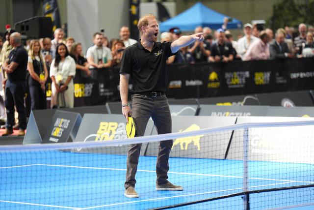 Britain's Prince Harry, Duke of Sussex, reacts as he takes part in a session of Pickleball during an event to mark the 'Invictus Games Birmingham 2027: One Year To Go', at the NEC in Birmingham, central England on July 10, 2026. (Photo by Aaron Chown / POOL / AFP)
