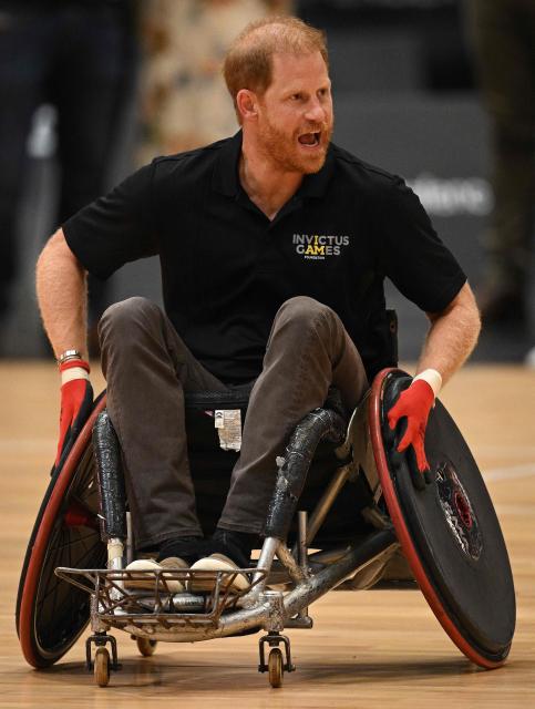 Britain's Prince Harry, Duke of Sussex, reacts as he takes part in a session of wheelchair rugby during an event to mark the 'Invictus Games Birmingham 2027: One Year To Go', at the NEC in Birmingham, central England on July 10, 2026. (Photo by Oli SCARFF / AFP)