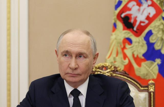 In this pool photograph distributed by the Russian state agency Sputnik, Russia's President Vladimir Putin chairs a Security Council meeting via videolink in Moscow on July 10, 2026. (Photo by Pavel Byrkin / POOL / AFP)