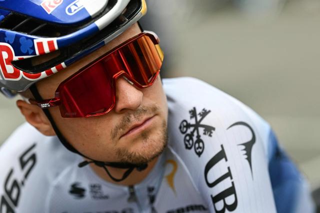Pinarello Q36.5 Pro Cycling Team's British rider Tom Pidcock awaits the start of the 7th stage of the 113th edition of the Tour de France cycling race, 175 km between Hagetmau and Bordeaux in southwestern France, on July 10, 2026. (Photo by Loic VENANCE / AFP)