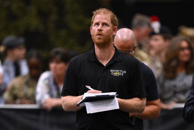 Britain's Prince Harry, Duke of Sussex makes notes during an event to mark the 'Invictus Games Birmingham 2027: One Year To Go', at the NEC in Birmingham, central England on July 10, 2026. (Photo by Oli SCARFF / AFP)
