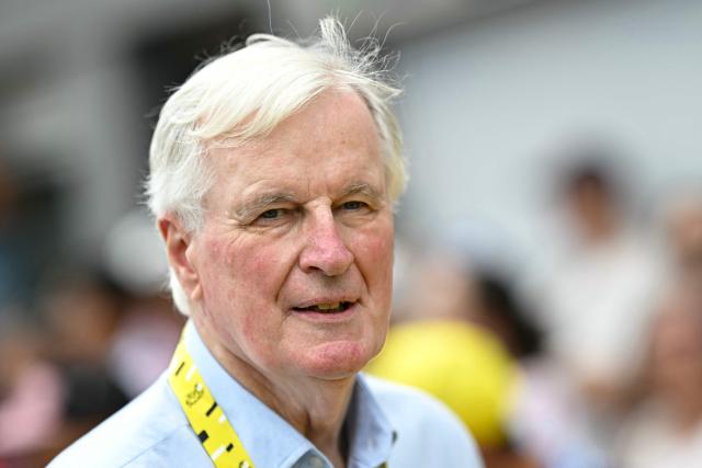Former French Prime Minister Michel Barnier looks on at the start of the 7th stage of the 113th edition of the Tour de France cycling race, 175 km between Hagetmau and Bordeaux in southwestern France, on July 10, 2026. (Photo by Loic VENANCE / AFP)