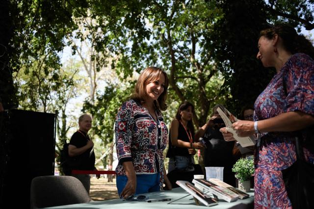 (FILES) France’s former Minister of Environment Segolene Royal signs her book during the LFI summer days event (AMFIS 2023) in Chateauneuf-sur-Isere, southeastern France on August 25, 2023. Segolene Royal, unsuccessful candidate in the 2007 presidential election and former minister, announced on July 10, 2026 that she would take part in the primary of the socialists, the terms of which were defined during a vote of PS activists. (Photo by JEFF PACHOUD / AFP)