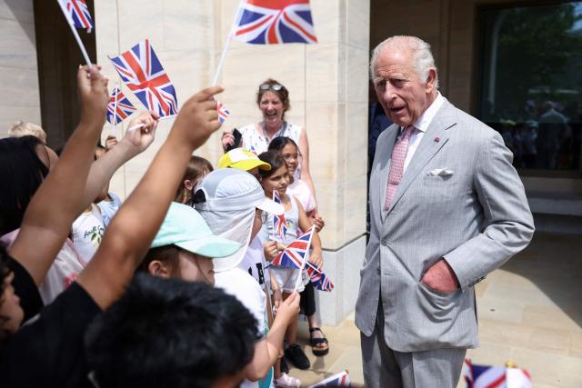 Britain's King Charles III chats with children waving Union flags as he visits the Stephen A. Schwarzman Centre for the Humanities at the University of Oxford, west of London on July 10, 2026. (Photo by Toby Shepheard / POOL / AFP)
