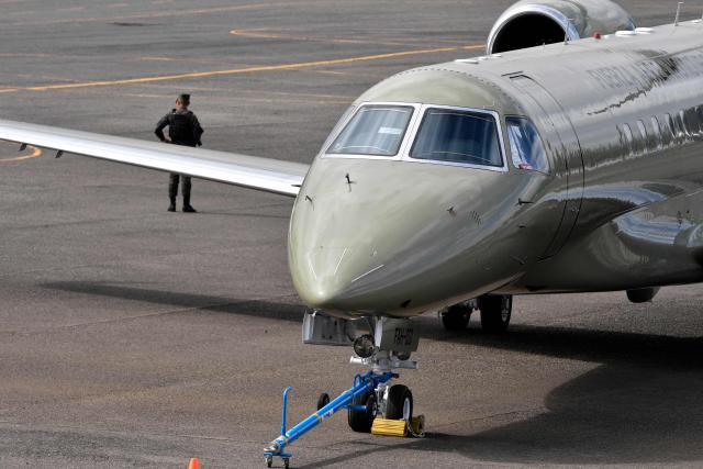 View of the Honduran presidential airplane, which will be auctioned off as part of austerity measures, as it remains parked at the Hernan Acosta Mejia Air Base in Tegucigalpa on July 10, 2026. The Embraer Legacy 600 jet, which purchase and maintenance have been marred by allegations of corruption, was acquired by Honduran President (2014–2022) Juan Orlando Hernandez. (Photo by Orlando SIERRA / AFP)