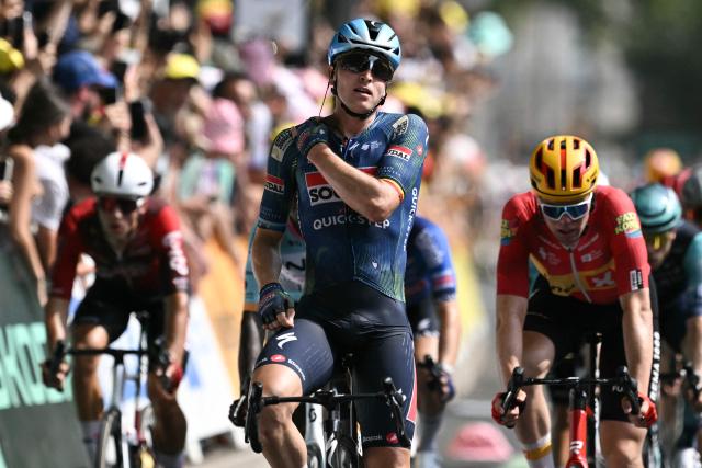 Soudal Quick-Step team's Belgian rider Tim Merlier cycles to the finish line to win the 7th stage ahead of Uno-X Mobility team's Norwegian rider Soren Waerenskjold (R) during the 113th edition of the Tour de France cycling race, 175 km between Hagetmau and Bordeaux in southwestern France, on July 10, 2026. (Photo by Jeff PACHOUD / AFP)