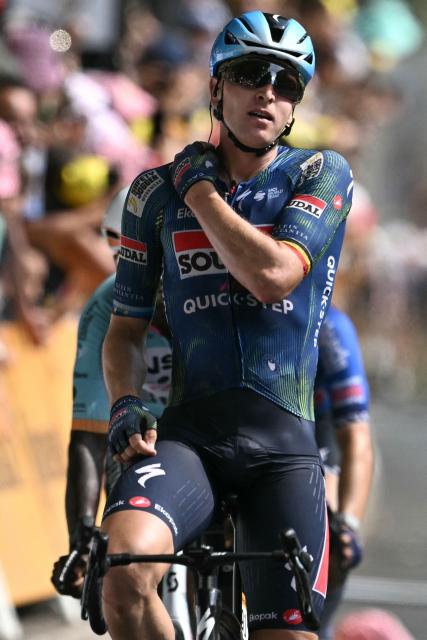 Soudal Quick-Step team's Belgian rider Tim Merlier cycles to the finish line to win the 7th stage of the 113th edition of the Tour de France cycling race, 175 km between Hagetmau and Bordeaux in southwestern France, on July 10, 2026. (Photo by Jeff PACHOUD / AFP)