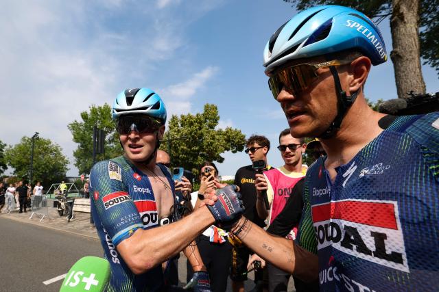 Soudal Quick-Step team's Belgian rider Tim Merlier (L) celebrates after winning the 7th stage of the 113th edition of the Tour de France cycling race, 175 km between Hagetmau and Bordeaux in southwestern France, on July 10, 2026. (Photo by Gonzalo Fuentes / POOL / AFP)