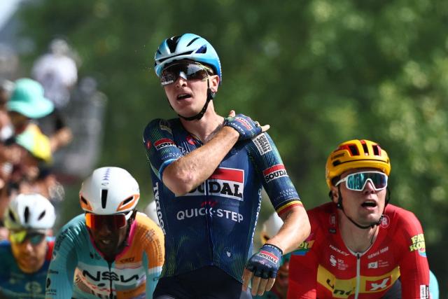 Soudal Quick-Step team's Belgian rider Tim Merlier (C) cycles to the finish line to win the 7th stage ahead of Uno-X Mobility team's Norwegian rider Soren Waerenskjold (R) and NSN Cycling Team's Eritrean rider Biniam Girmay (L) during the 113th edition of the Tour de France cycling race, 175 km between Hagetmau and Bordeaux in southwestern France, on July 10, 2026. (Photo by Anne-Christine POUJOULAT / AFP)