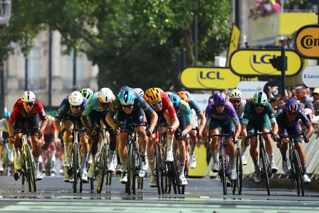 Soudal Quick-Step team's Belgian rider Tim Merlier (C) sprints to the finish line to win the 7th stage of the 113th edition of the Tour de France cycling race, 175 km between Hagetmau and Bordeaux in southwestern France, on July 10, 2026. (Photo by Anne-Christine POUJOULAT / AFP)
