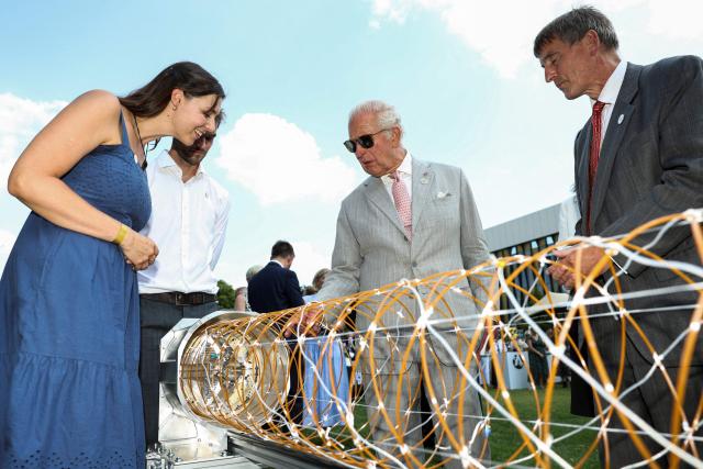 Britain's King Charles III takes part in a presentation of a deployable antenna during a visit to the Harwell Science and Innovation Campus, during a visit to Oxford, west of London on July 10, 2026. (Photo by Toby Shepheard / POOL / AFP)