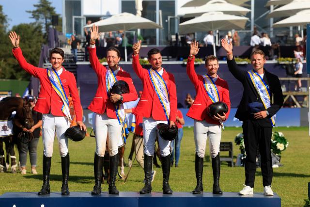 The Swiss team (L-R) Gaetan Joliat, Martin Fuchs, Steve Guerdat, Jason Smith and Peter van der Waaij react after winning the Falsterbo Nations Cup 2026 international show jumping event as part of the Falsterbo Horse Show in Falsterbo, Sweden, on July 10, 2026. (Photo by Andreas HILLERGREN / TT News Agency / AFP) / Sweden OUT