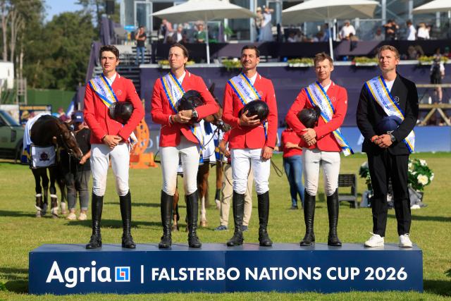 The Swiss team (L-R) Gaetan Joliat, Martin Fuchs, Steve Guerdat, Jason Smith and Peter van der Waaij react after winning the Falsterbo Nations Cup 2026 international show jumping event as part of the Falsterbo Horse Show in Falsterbo, Sweden, on July 10, 2026. (Photo by Andreas HILLERGREN / TT News Agency / AFP) / Sweden OUT