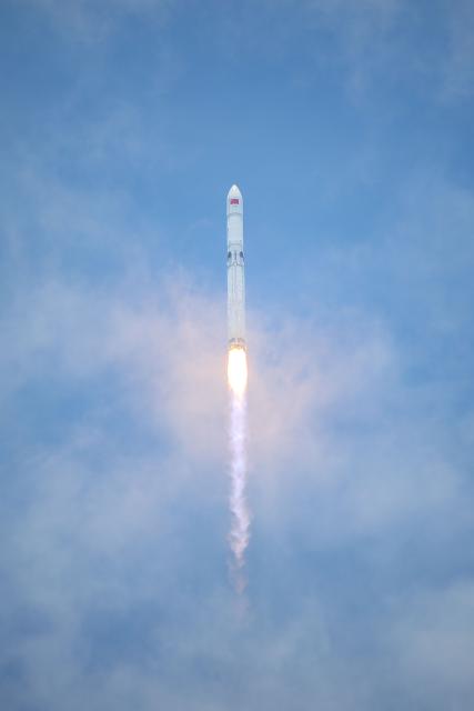 A Long March-10B carrier rocket lifts off from the Hainan Commercial Spacecraft Launch Site in Wenchang in China’s southern Hainan province on July 10, 2026 before the first stage was recovered via a net-based capture system on an offshore recovery platform. The mission, which also launched a satellite into space, marked China's first successful controlled recovery of a carrier rocket's first stage. (Photo by CNS / AFP) / China OUT