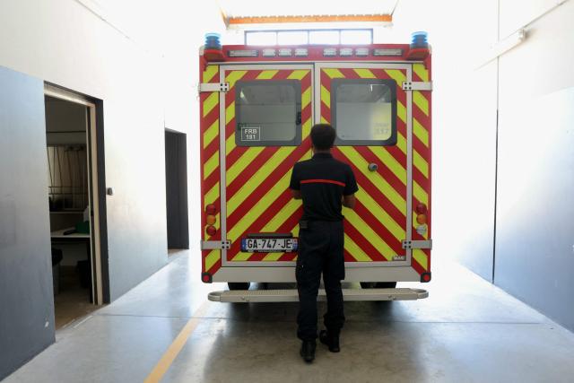 A firefighter of Departmental Fire and Rescue Service (SDIS 77) checks an ambulance at a fire station in Ferrières-en-Brie, the eastern suburbs of Paris, on July 10, 2026. With 36°C in the fire station and some improvised DIY solutions, firefighters are also suffering from the heatwave hitting France. (Photo by Thomas SAMSON / AFP)