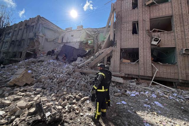 Ukrainian rescuers clear debris at the site of a Russian airstrike in Zaporizhzhia on July 10, 2026, amid the Russian invasion of Ukraine. (Photo by Darya NAZAROVA / AFP)