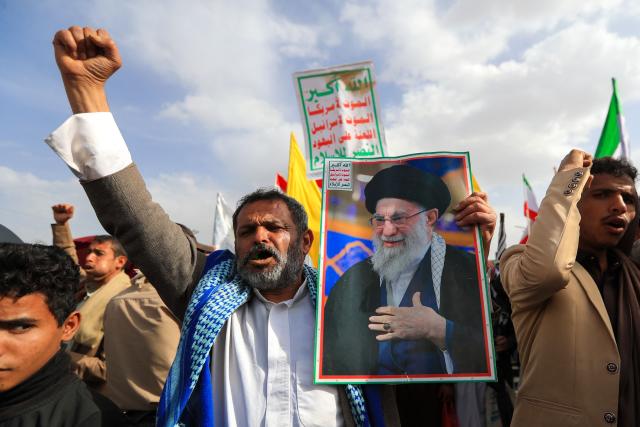 A Yemeni supporter of the Iran-backed Houthi movement holds a portrait of Iran's slain supreme leader Ayatollah Ali Khamenei during a protest against US strikes on Iran in Sanaa on July 10, 2026. Iran's top negotiator Mohammad Bagher Ghalibaf on July 10 said the conflict with the United States would not end with Tehran's surrender, after hostilities between the decades-old foes resumed this week with tit-for-tat attacks. (Photo by Mohammed HUWAIS / AFP)