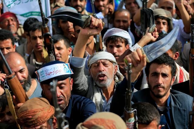 Armed Yemeni supporters of the Iran-backed Houthi movement brandish their weapons during a protest against US strikes on Iran in Sanaa on July 10, 2026. Iran's top negotiator Mohammad Bagher Ghalibaf on July 10 said the conflict with the United States would not end with Tehran's surrender, after hostilities between the decades-old foes resumed this week with tit-for-tat attacks. (Photo by Mohammed HUWAIS / AFP)
