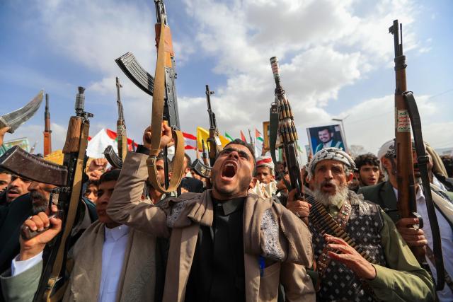 Armed Yemeni supporters of the Iran-backed Houthi movement brandish their weapons during a protest against US strikes on Iran in Sanaa on July 10, 2026. Iran's top negotiator Mohammad Bagher Ghalibaf on July 10 said the conflict with the United States would not end with Tehran's surrender, after hostilities between the decades-old foes resumed this week with tit-for-tat attacks. (Photo by Mohammed HUWAIS / AFP)