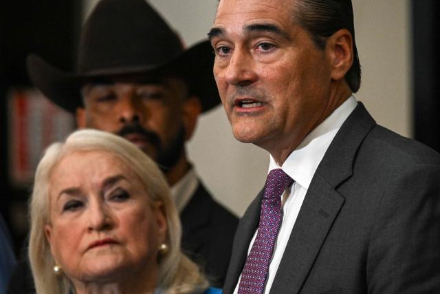 Sean Teare (R), Harris County District Attorney, speaks alongside US Representative Slyvia Garcia (L), Democrat from Texas, and attorney Hugo Balderas-Ibarra (C) during a news conference to discuss the case of Lorenzo Salgado Araujo, in Houston, Texas, on July 10, 2026. Lorenzo Salgado Araujo was killed by an Immigration and Customs Enforcement (ICE) officer in Houston, Texas, early on July 7, marking the first fatal shooting involving US immigration officers since two January killings in the northern city of Minneapolis that drew national headlines. (Photo by RONALDO SCHEMIDT / AFP)